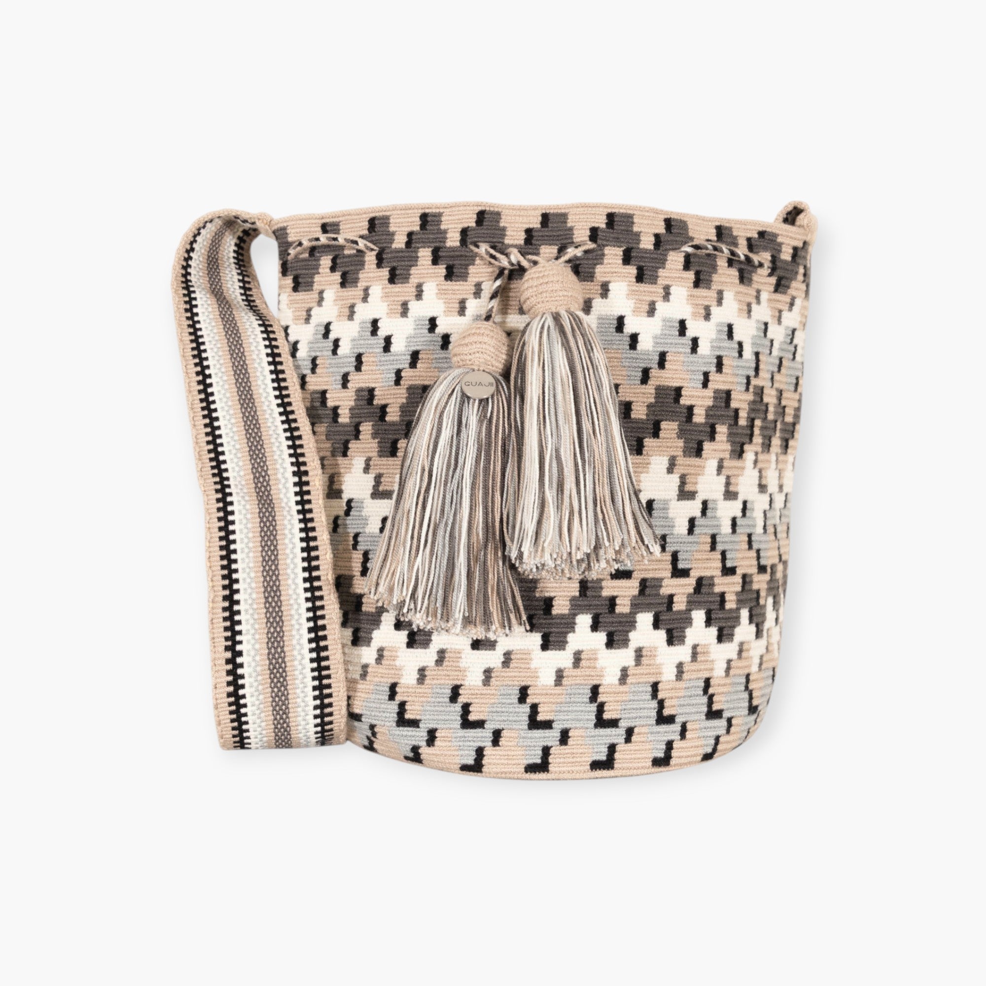 Woven bag with geometric pattern and tassels on a white background